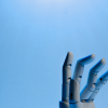 A robot hand reaching out from below, symbolizing the emergence of AI and the introduction of the future of ai