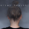 mental health: picture of a girl with dark cloud on forehead